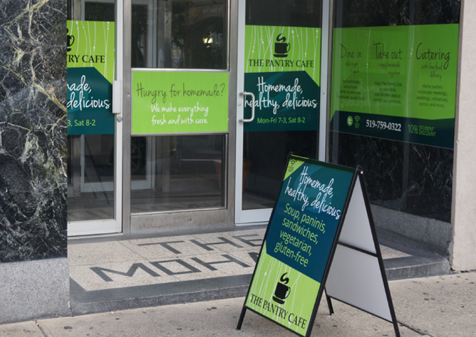 Storefront sign with a recognizable brand identity. Graphic design by Mindspin Studio for a retail venue in Brantford, Ontario.